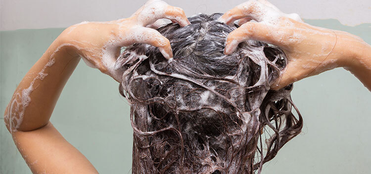 Woman cleansing Scalp