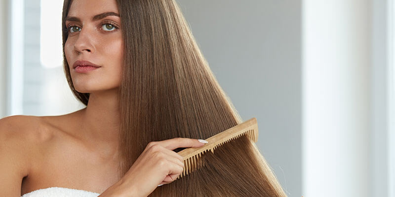 Woman combing hair